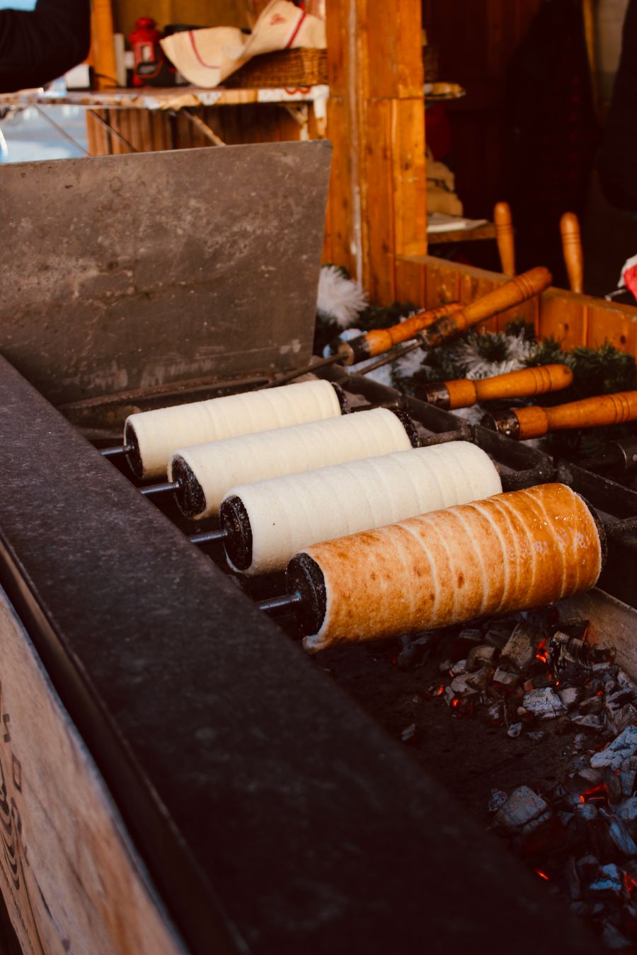 Chimney cakes cooked over charcoal at a street market (placeholder photo)