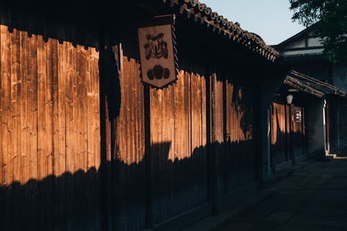 A wooden fence with a sign on it