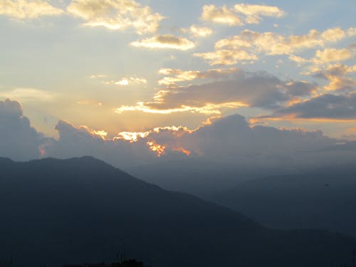 Scenic View of Mountains Against Sky at Sunset