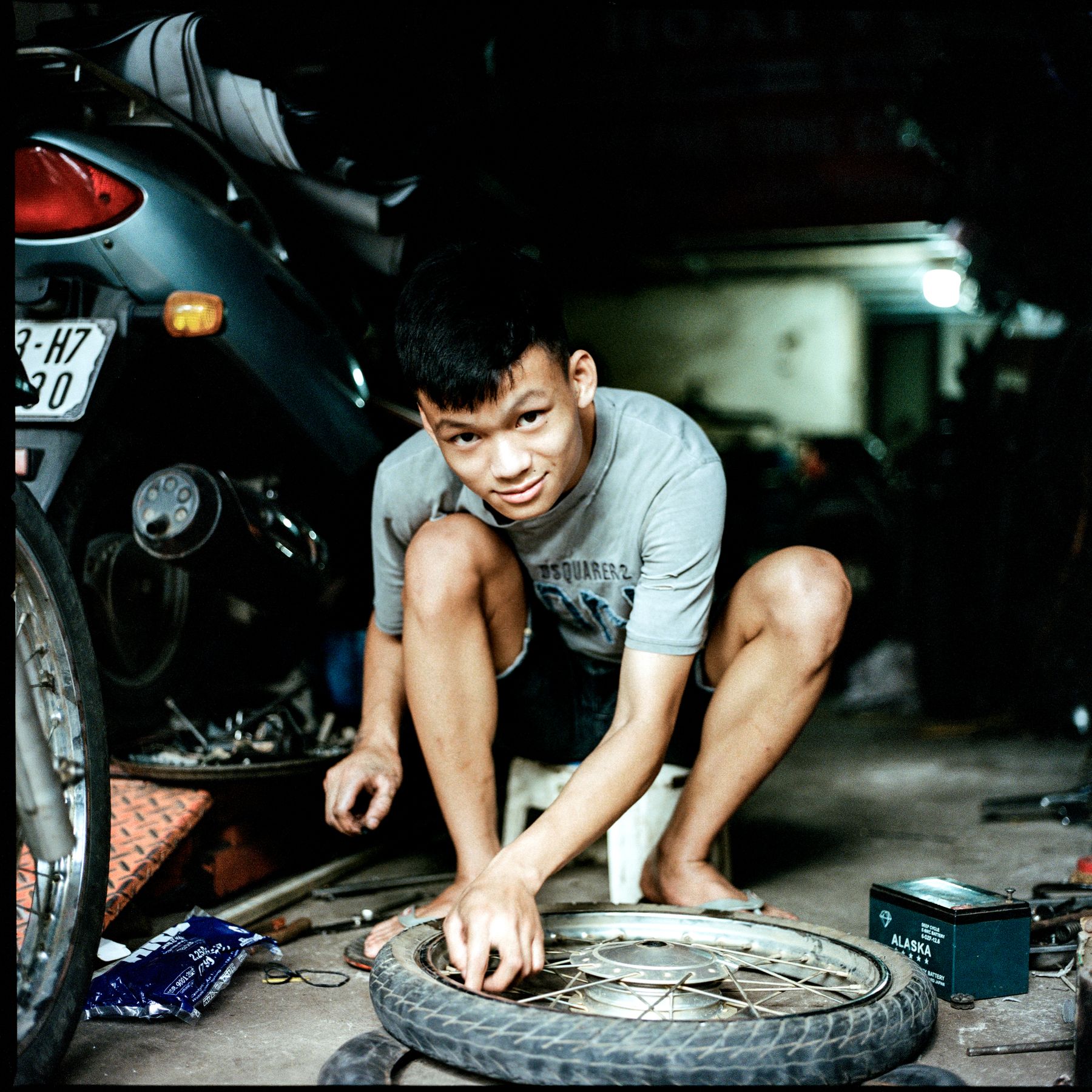 Mechanic working on a wheel in the workshop
