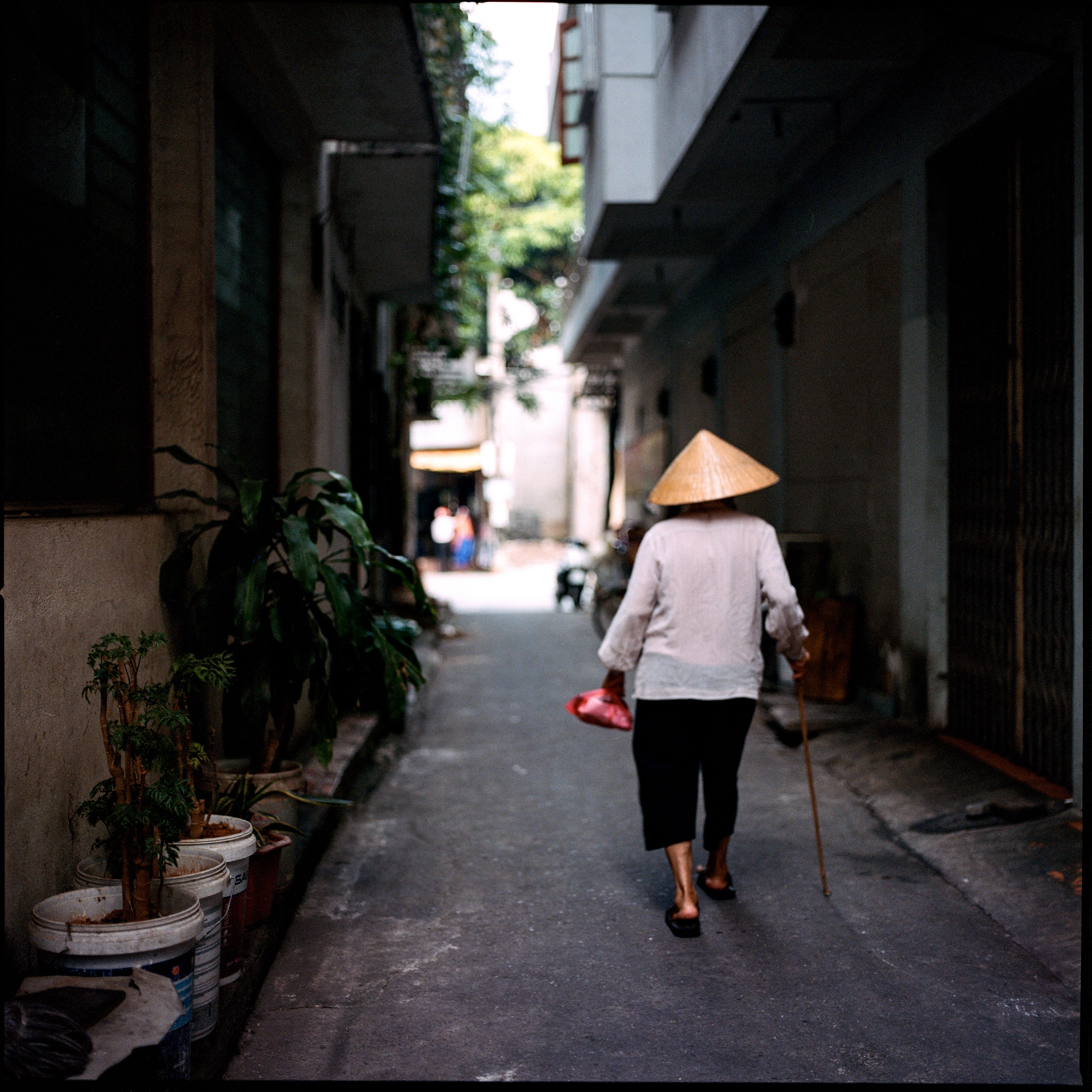 Elderly Woman Walking on Street in Town · Free Stock Photo