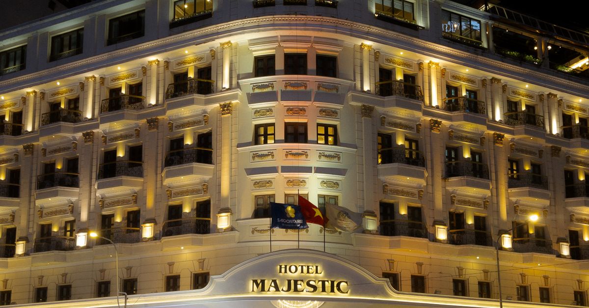 Stunning night view of the iconic Hotel Majestic in Ho Chi Minh City, Vietnam.