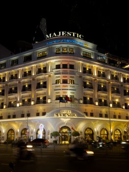 Stunning night view of the iconic Hotel Majestic in Ho Chi Minh City, Vietnam.