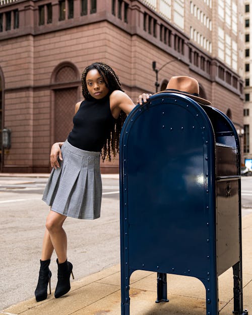 Woman Posing next to Mailbox