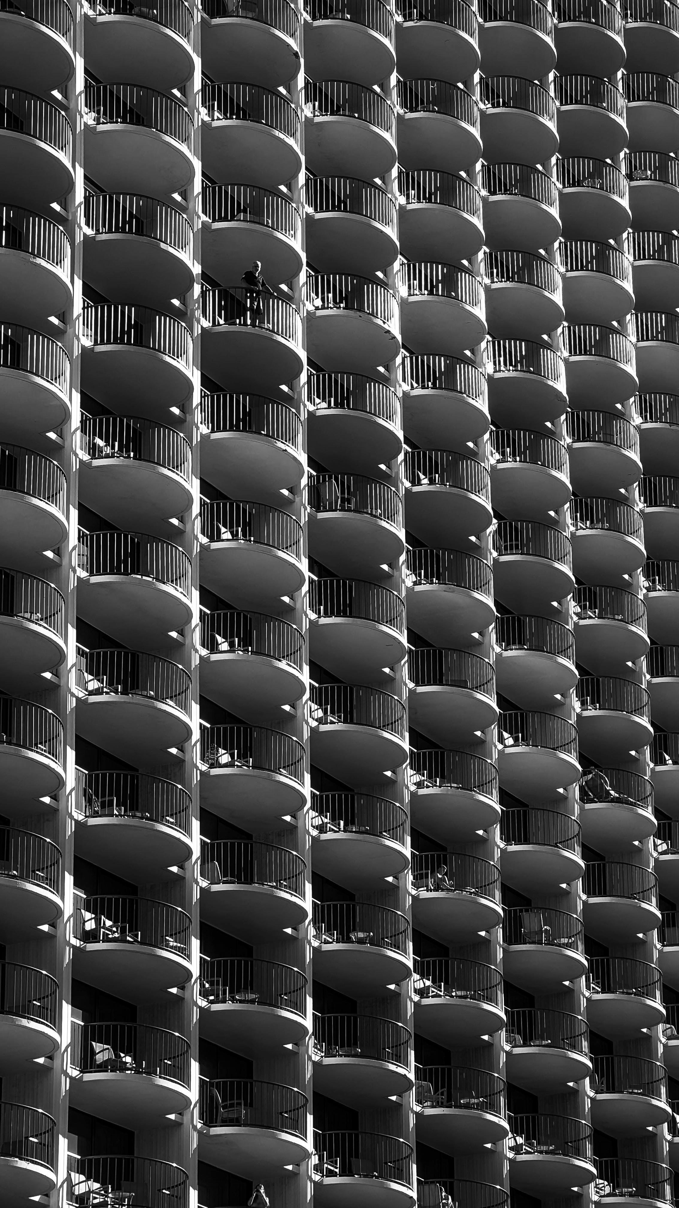 Black and white abstract view of a Chicago skyscraper's curved balconies.
