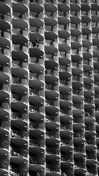 Black and white abstract view of a Chicago skyscraper's curved balconies.