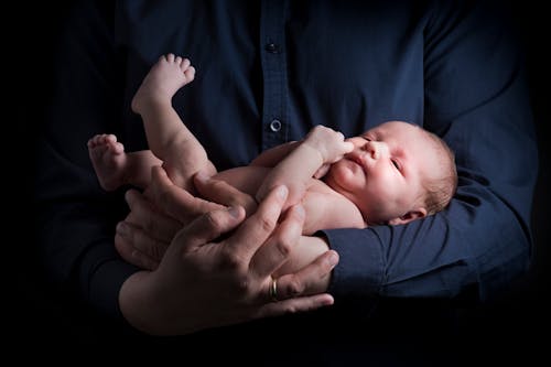 Man Carrying Baby