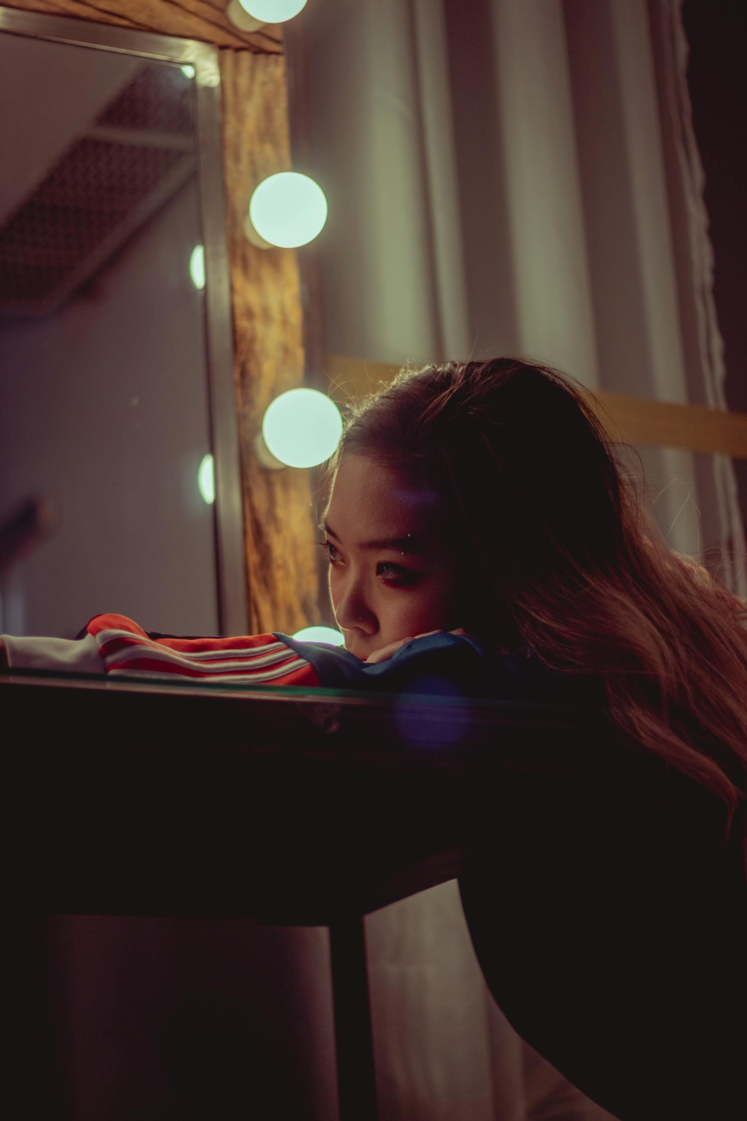 Woman Resting Face On Wooden Table · Free Stock Photo