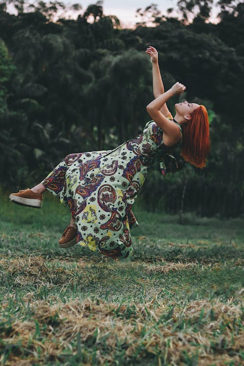 Free Time Lapse Jumpshot Photography of Woman Jumping on Grass Stock Photo