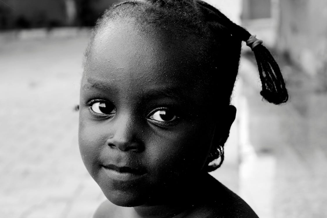Free Greyscale Close-up Photo of Young Girl Stock Photo