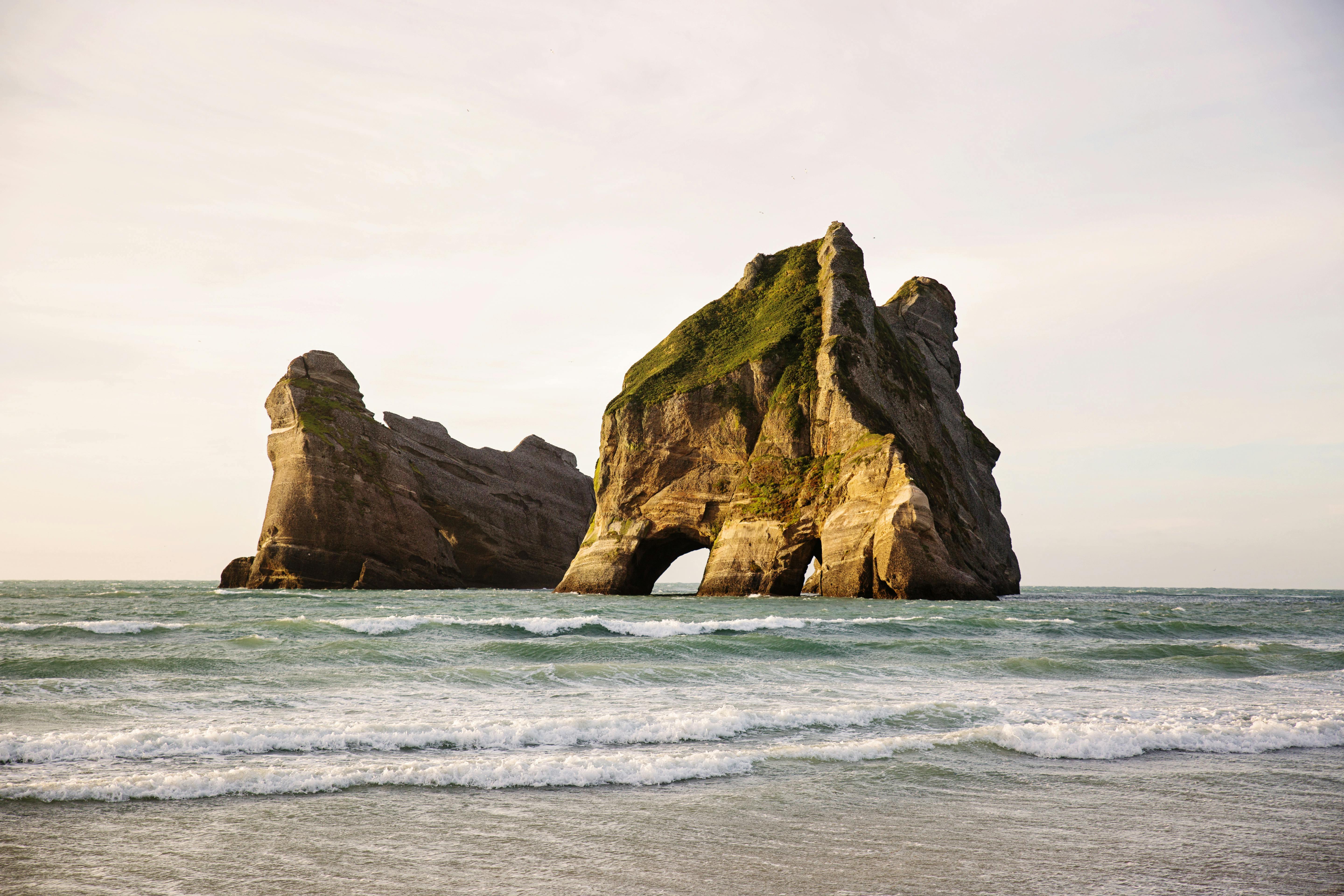 Landscape Photography of Two Islands in the Sea · Free Stock Photo