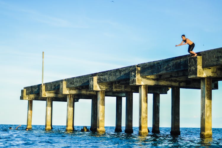 Person About To Jump On Dock