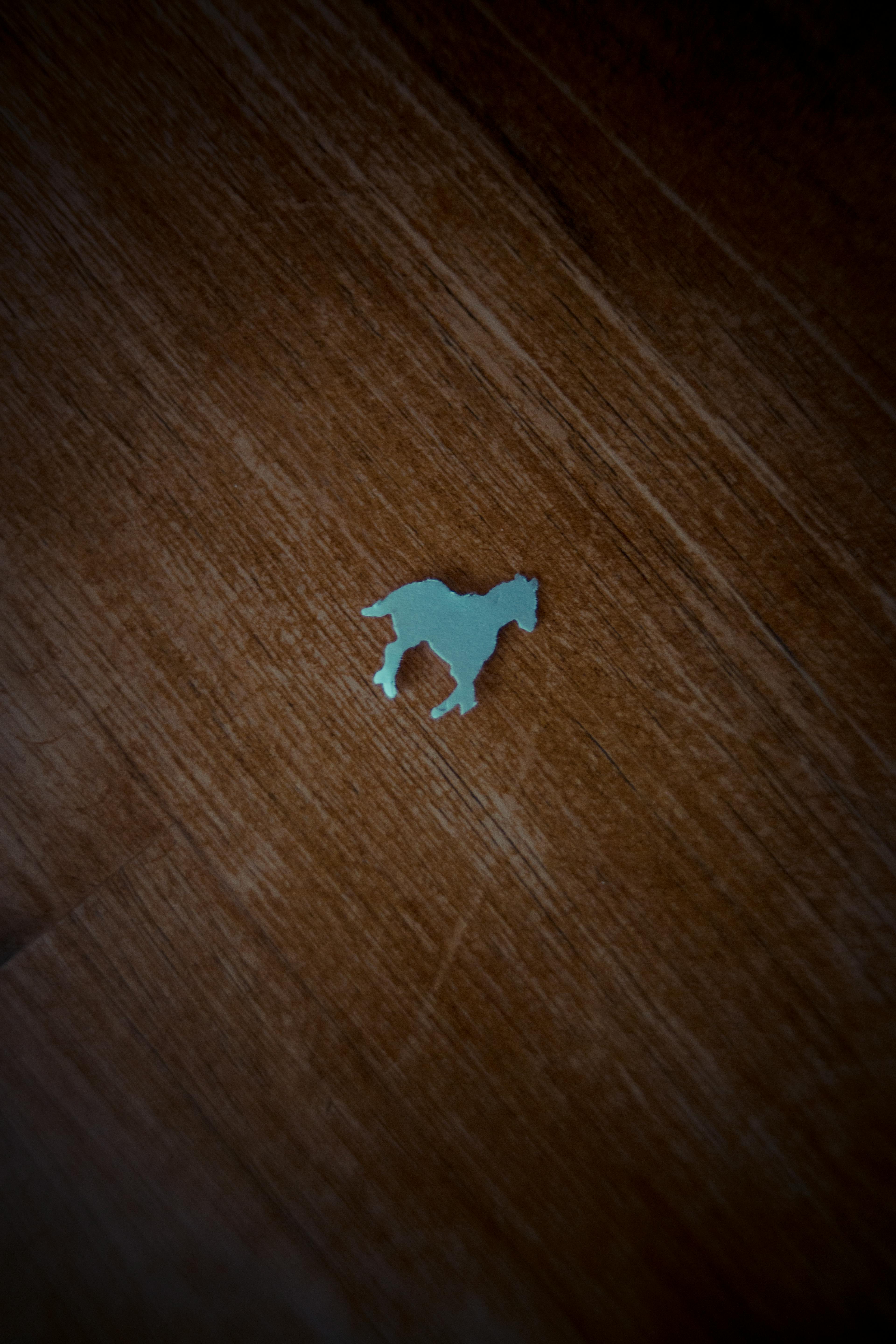 blue puzzle piece on brown wooden table