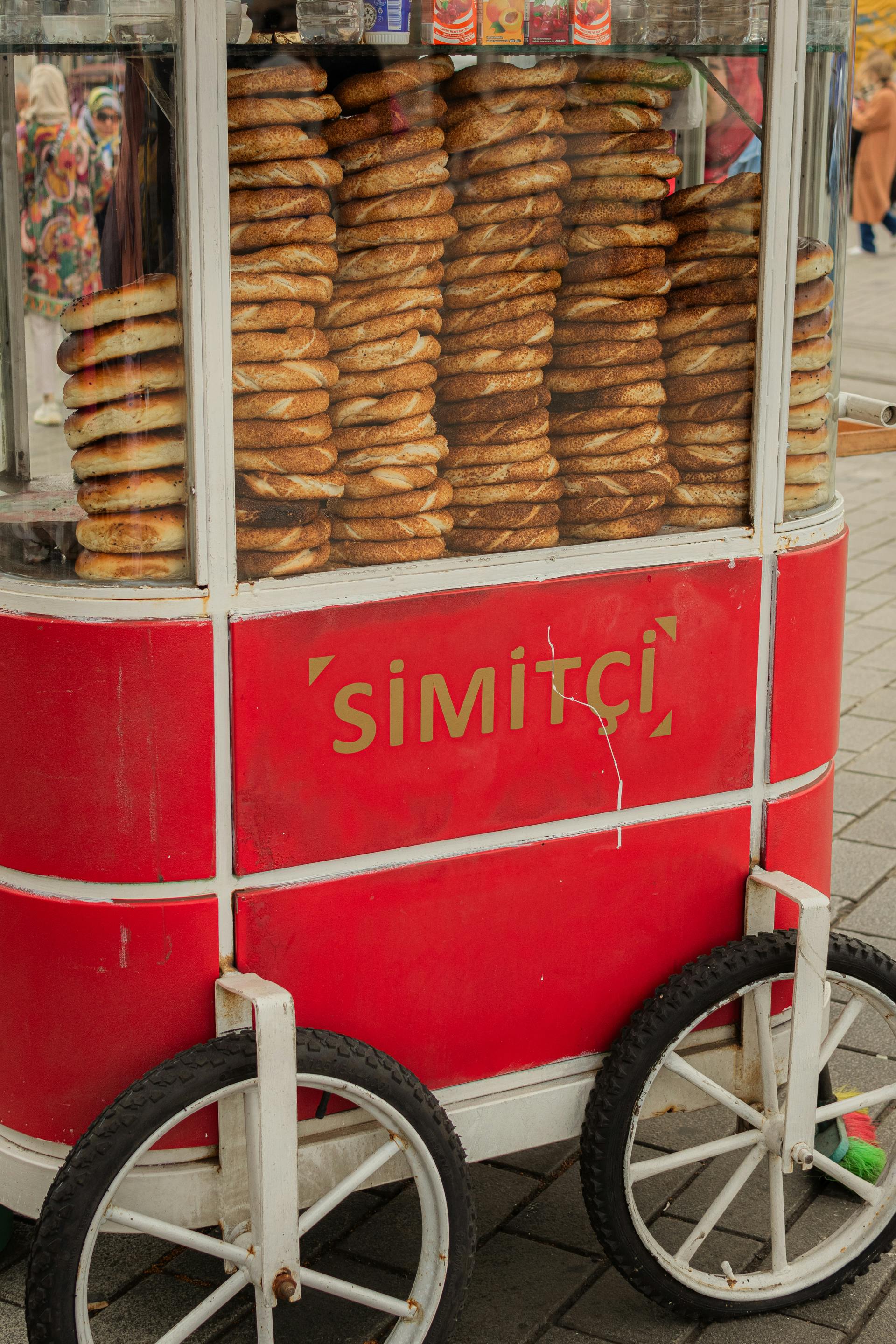 A Food Cart with Stacks of Simit Bread Standing on the Street · Free ...