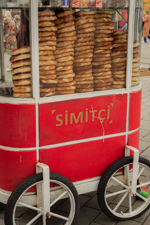 A Food Cart with Stacks of Simit Bread Standing on the Street · Free ...