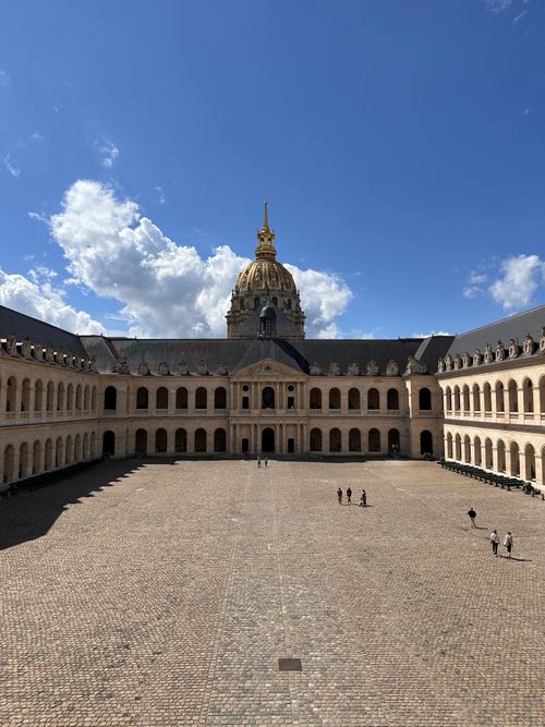 Free Elegant view of Les Invalides courtyard with golden dome under a bright blue sky in Paris. Stock Photo
