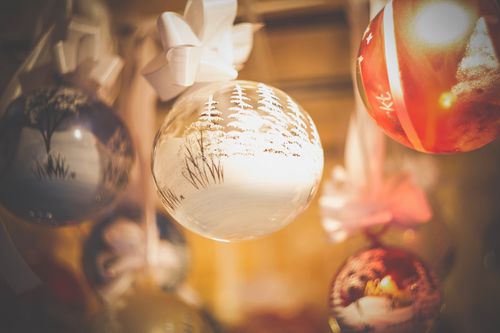 Free Beautiful close-up of hanging Christmas ornaments with festive decorations indoors. Stock Photo