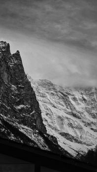 Stunning black and white image of snow-covered mountains in winter.