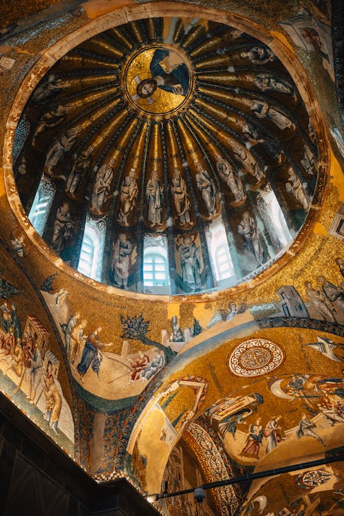 The dome of a church with a painting on it