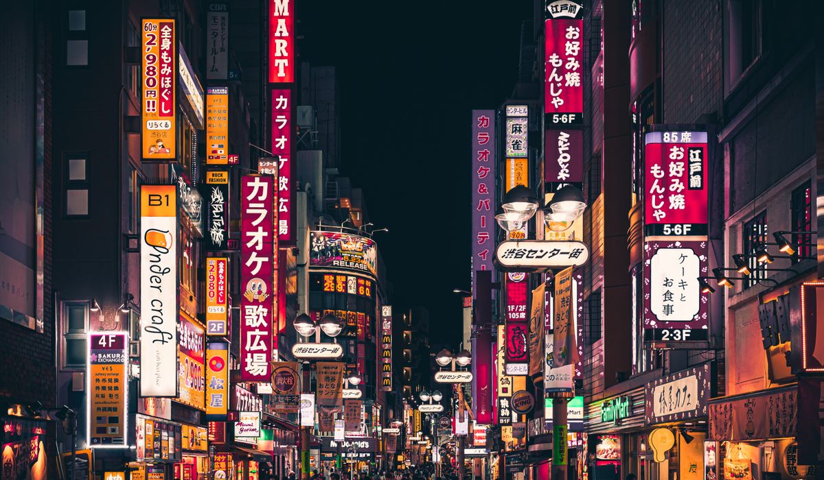 Shibuya crossing lit up at night
