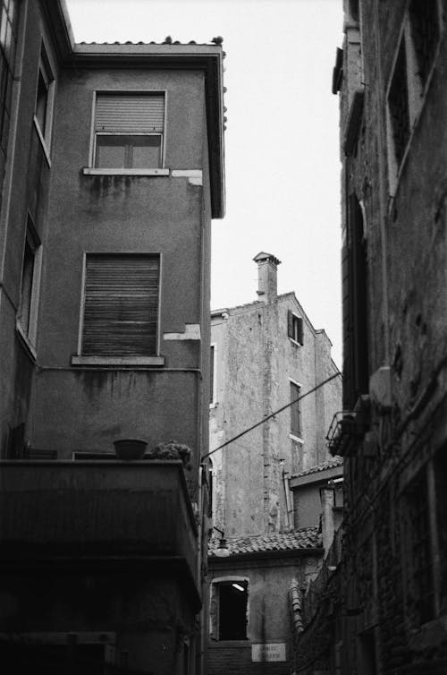 A black and white photo of an alley