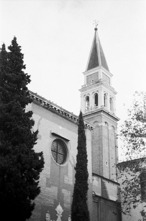A black and white photo of a church tower