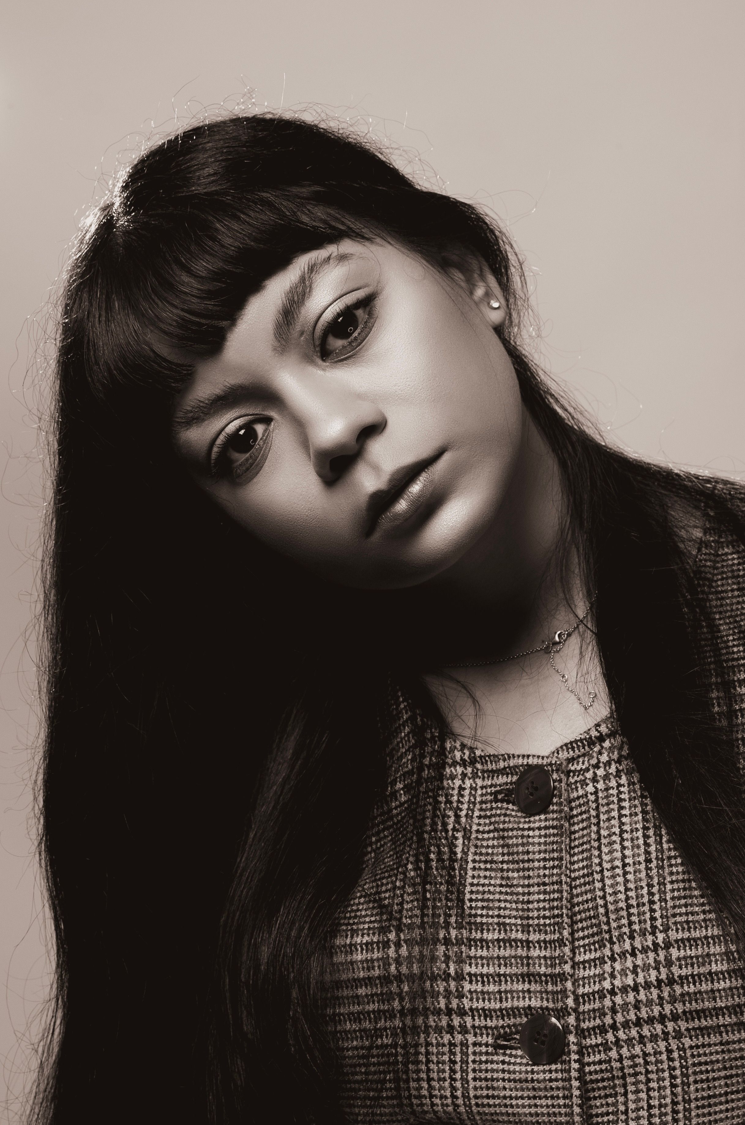 Sepia Toned Portrait of a Young Woman with Bangs · Free Stock Photo