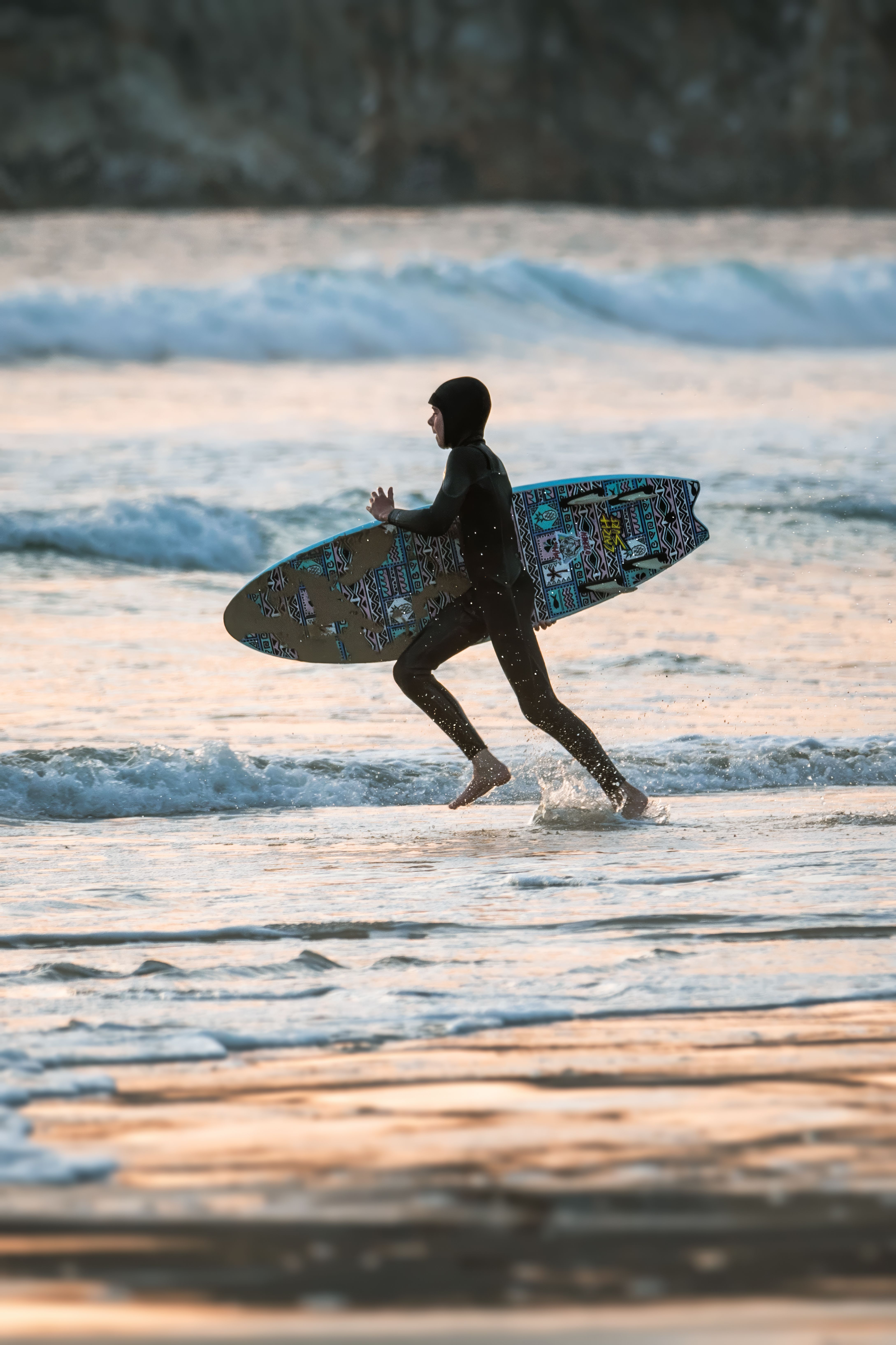 Surfer Running with Surfboard on Sea Shore · Free Stock Photo