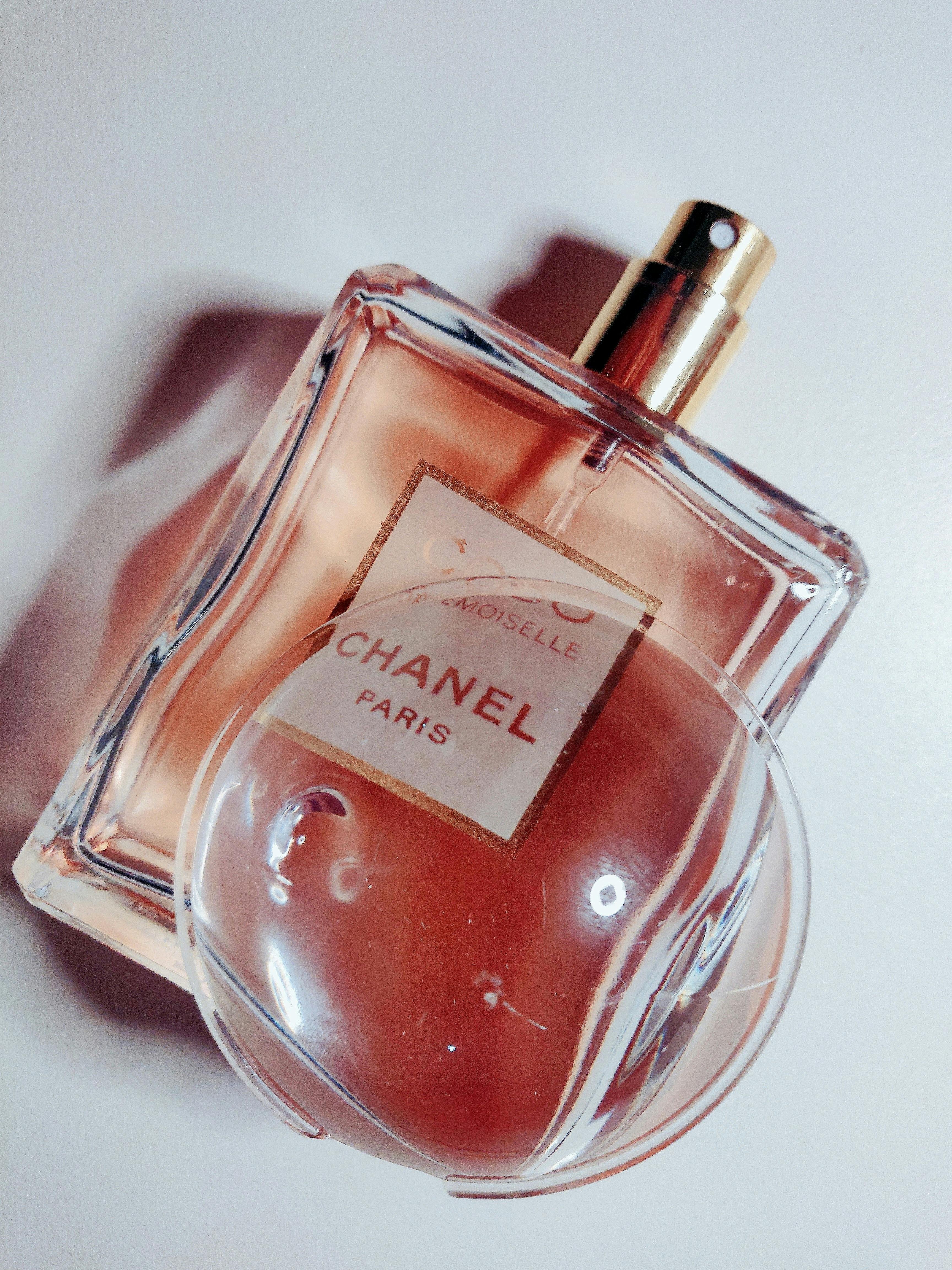 Jeddah Saudi Arabia March 31 2021 COCO chanel Floral scent concept. Perfume  bottle with lflowers over pink pastel background Flat lay and copy space  top view. Stock Photo