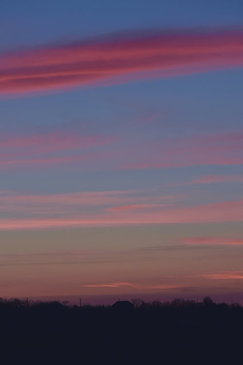 Free Pink Clouds at Blue Sky during Sunset Stock Photo