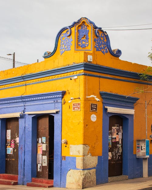 A building with blue and yellow paint on it