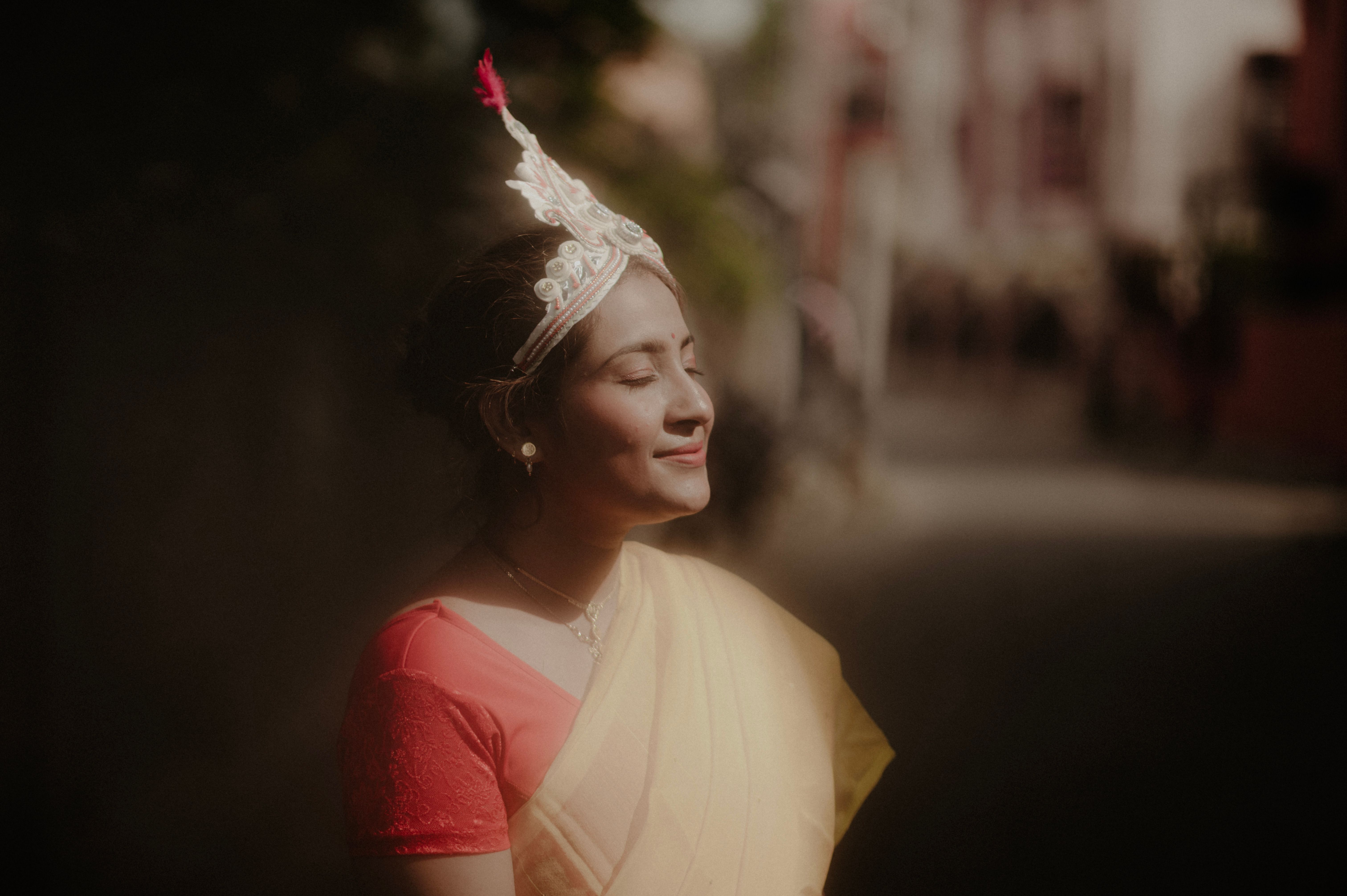 Smiling Woman in Traditional Dress and Tiara · Free Stock Photo