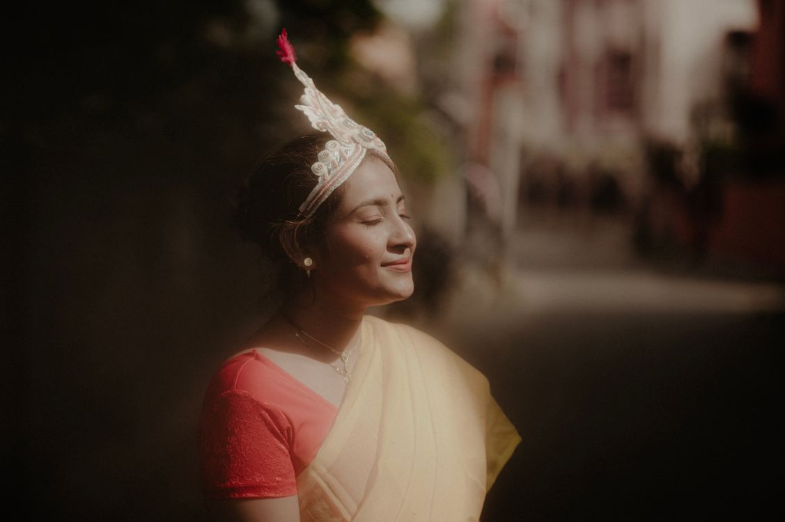 Smiling Woman in Traditional Dress and Tiara · Free Stock Photo