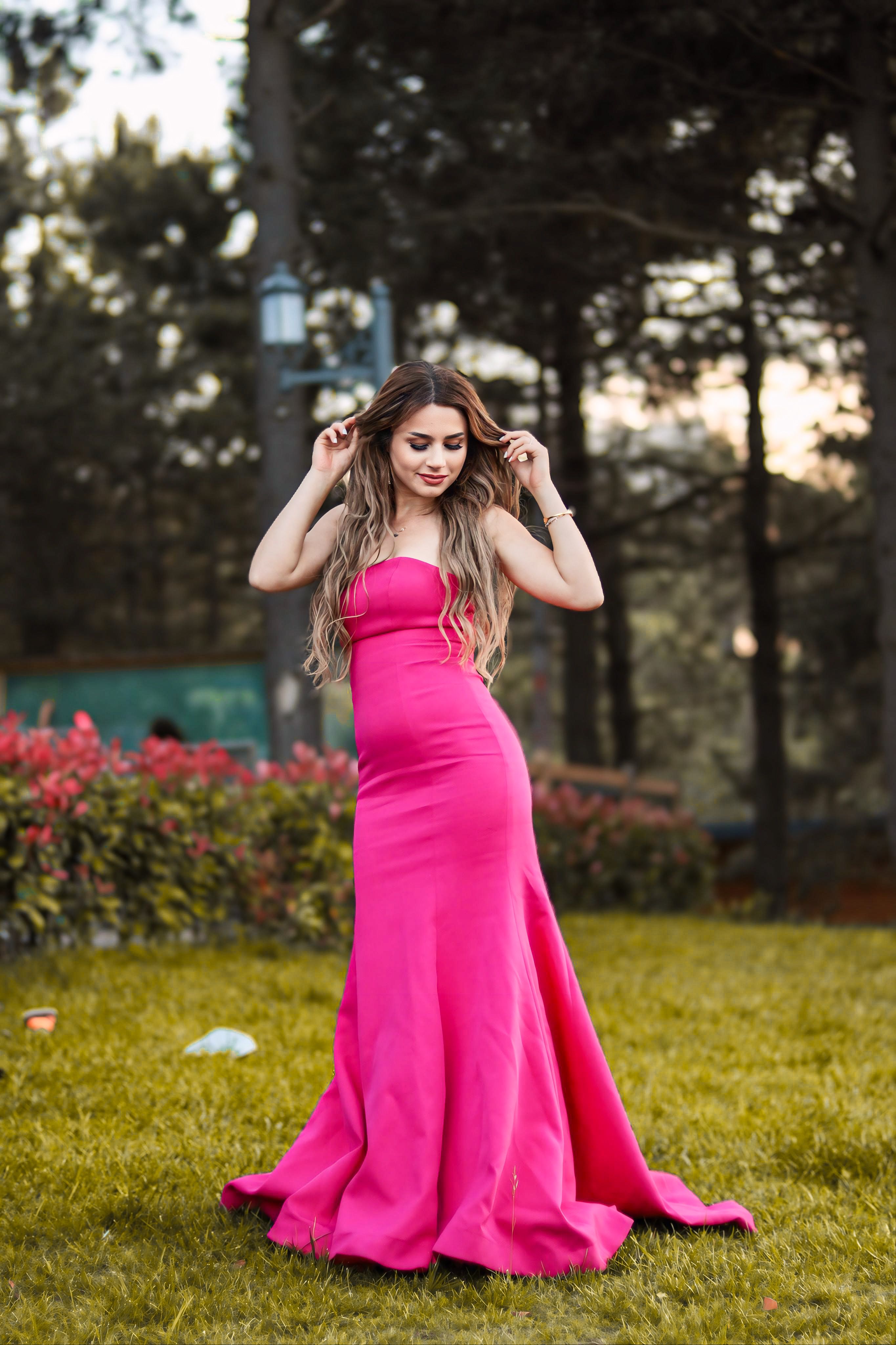 Woman Posing in Pink Dress in a Park · Free Stock Photo