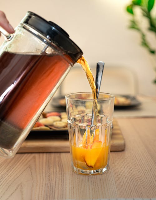 Бесплатное стоковое фото с алкогольный напиток, апельсиновый сок, банан