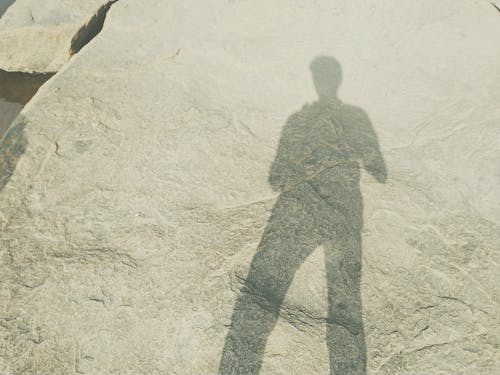 Shadow of Man on Sand