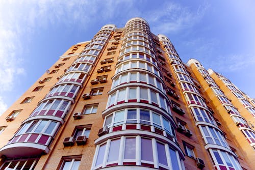 Brown and White Concrete Building Under the Sky