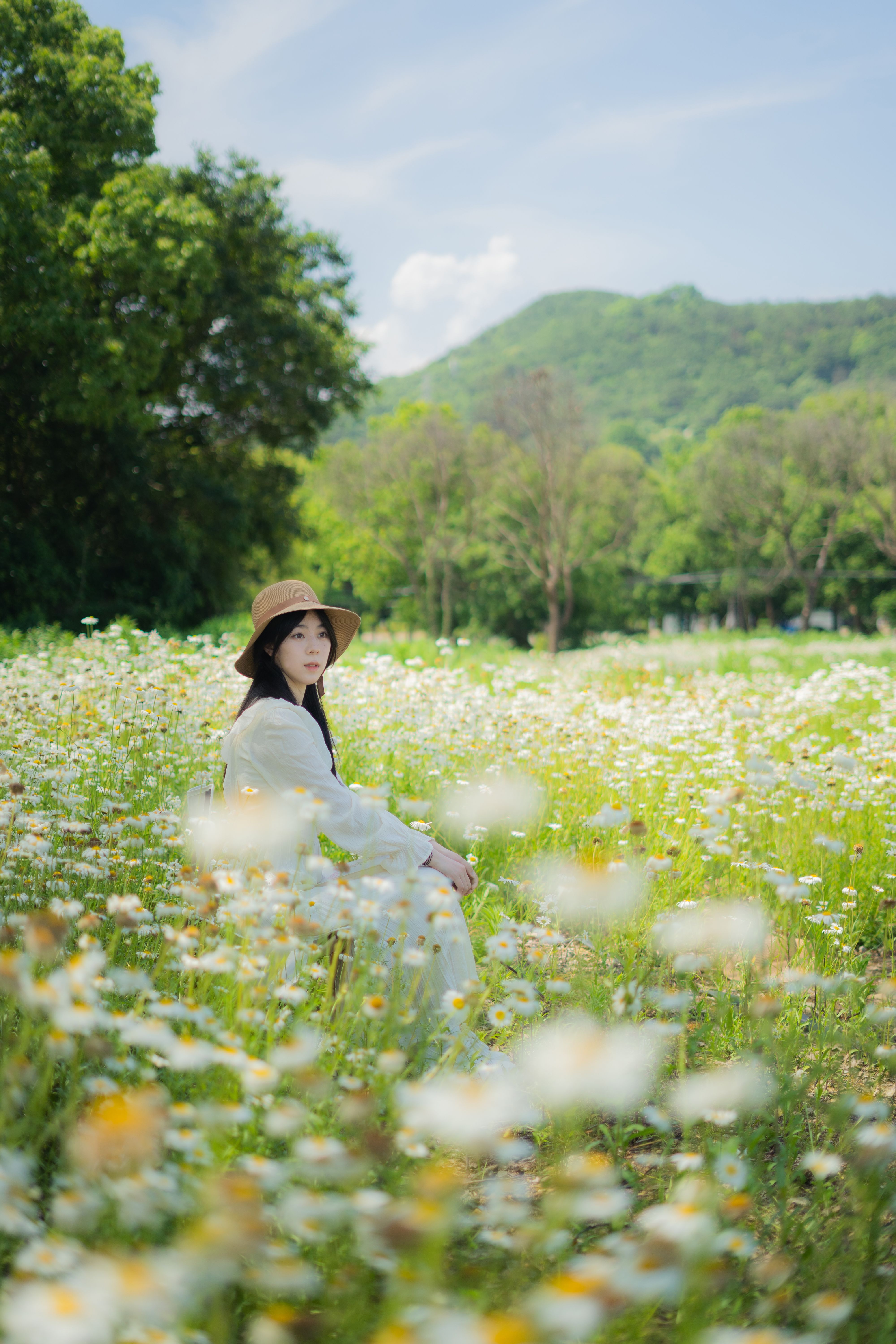 Woman Standing in a Field of Flowers · Free Stock Photo