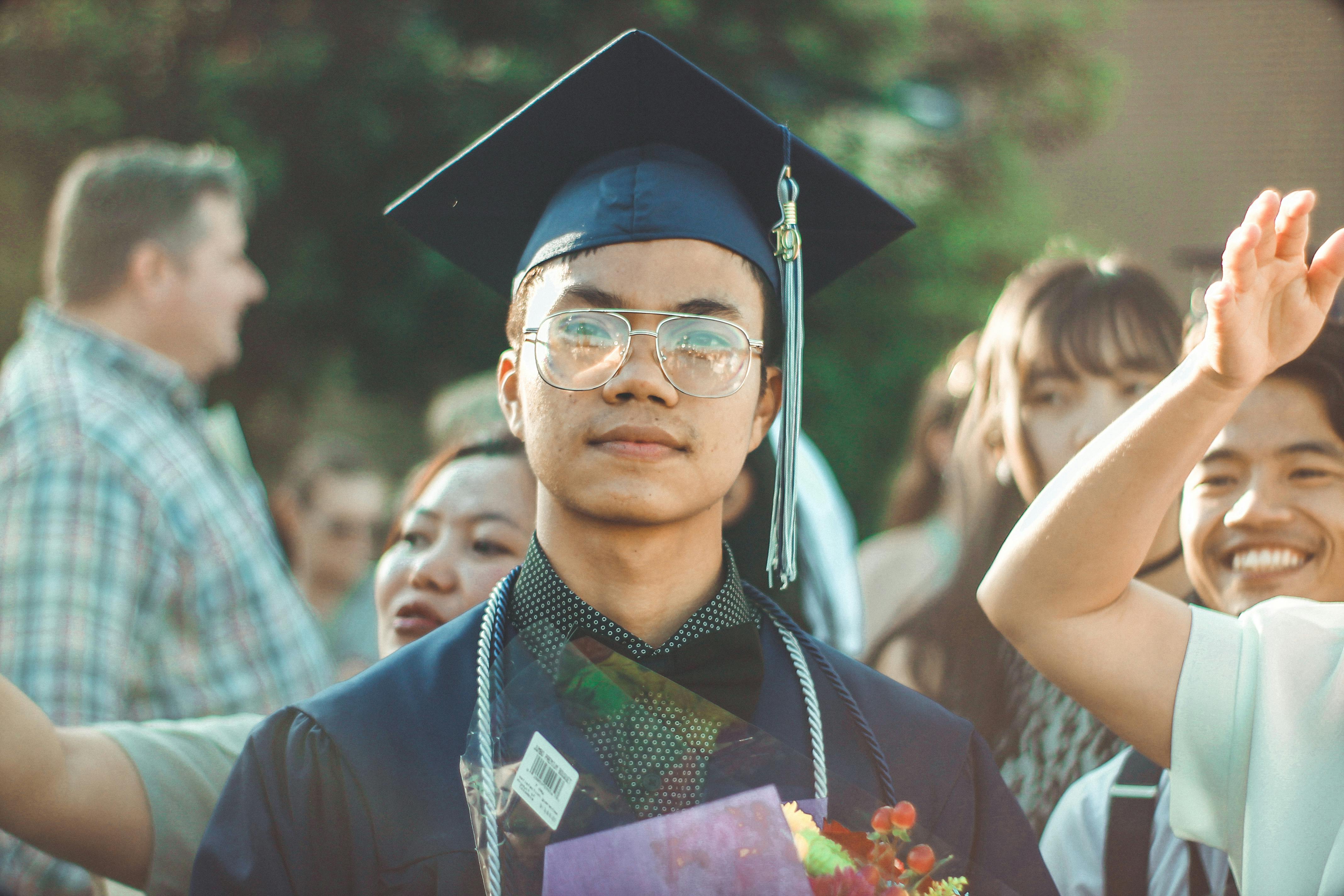 A man wearing academic dress. | Photo: Pexels