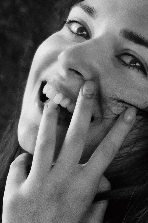 Free Expressive black and white portrait of a smiling woman in Kyiv, Ukraine. Stock Photo