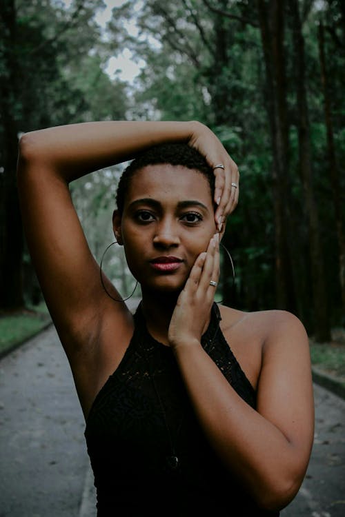 Close-Up Photo of a Woman Wearing Black Top