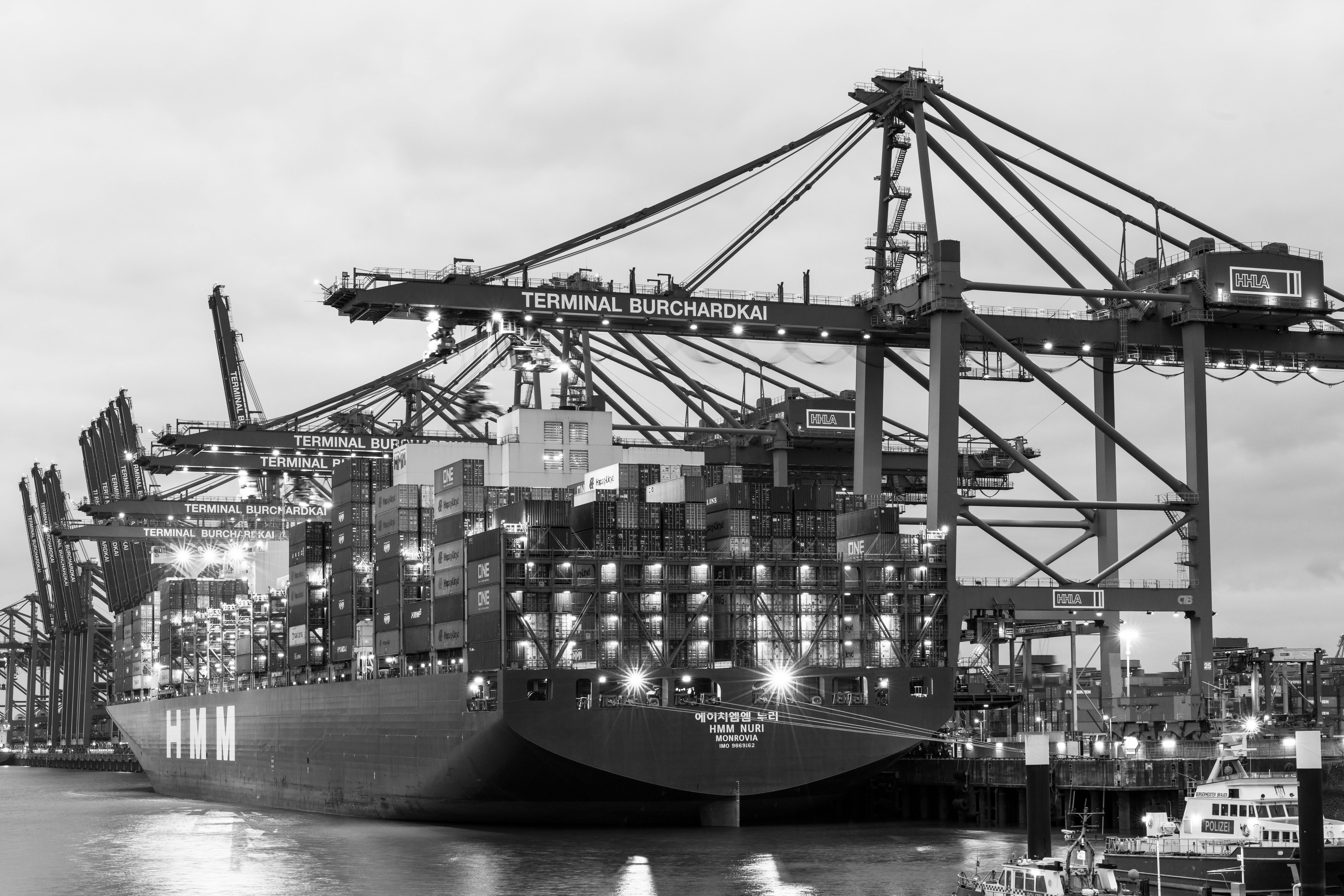 Monochrome view of container ship at Terminal Burchardkai in Hamburg harbor