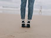 Photo of Person Wearing Denim Jeans