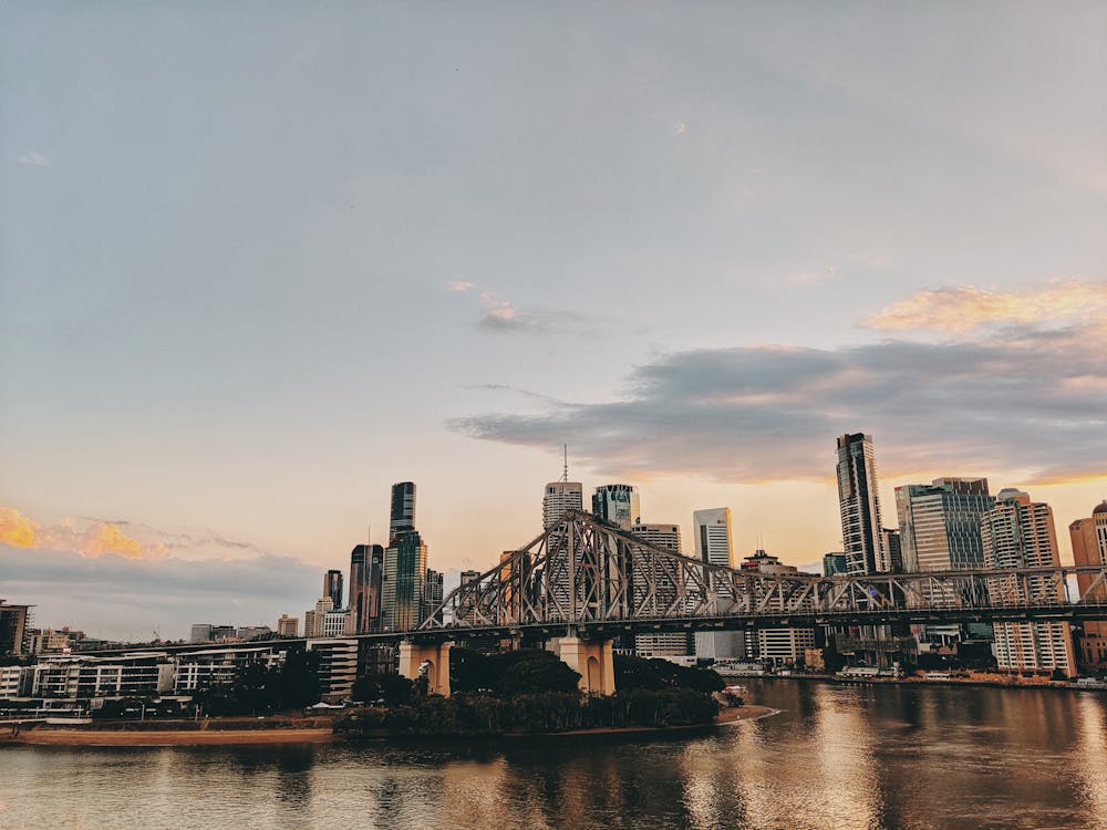 Free Photo of Bridge and Buildings During Golden Hour Stock Photo