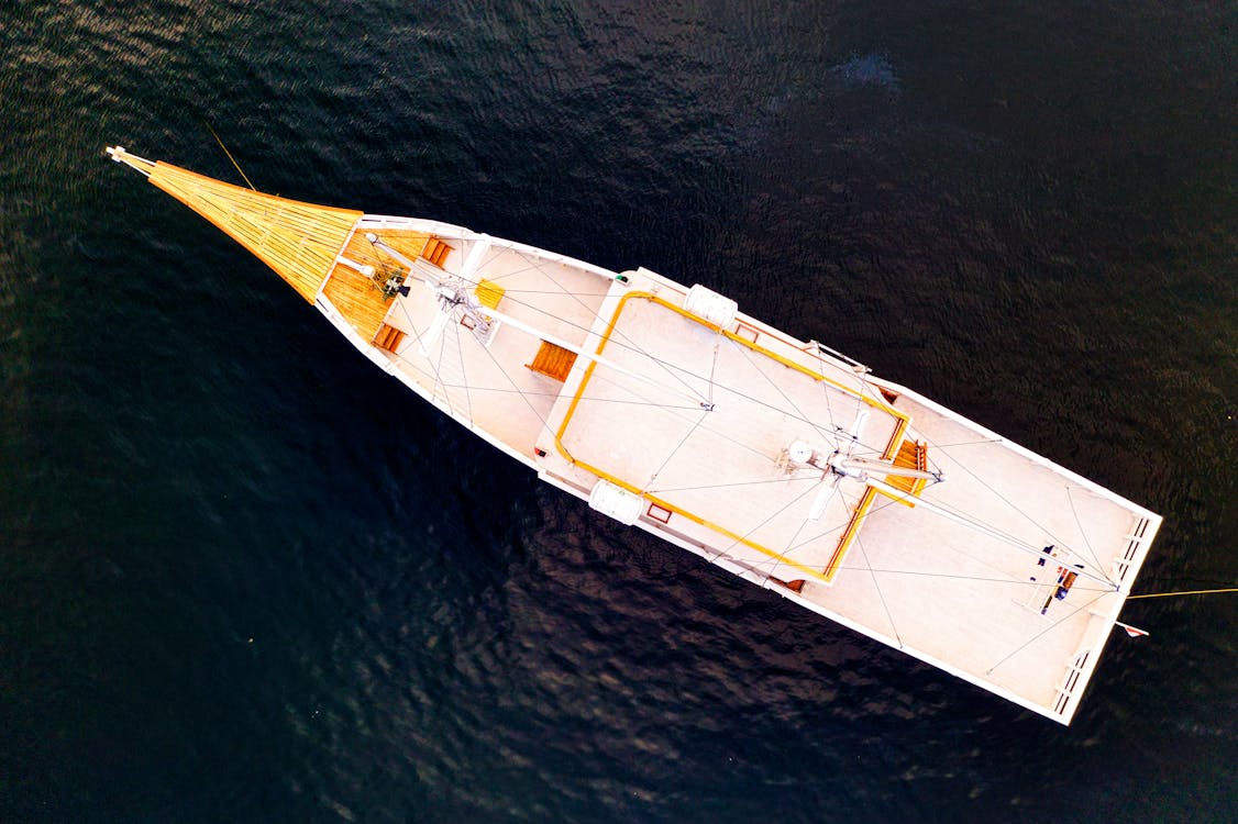 Free  Aerial View Photography of a  Boat on a Body of Water Stock Photo