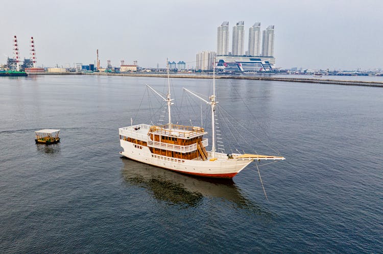 Aerial Photo Of A White Boat On Body Of Water