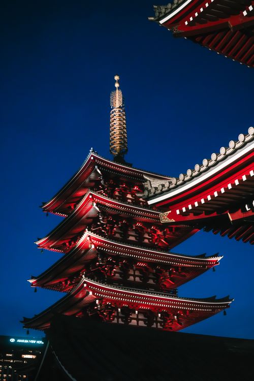 Free Stunning night view of a traditional Japanese pagoda illuminated in Tokyo, Japan. Stock Photo