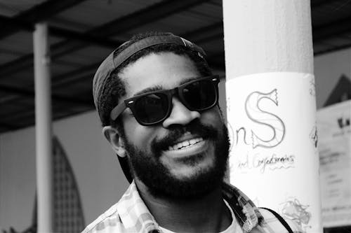 Black and White Photo of a Man Wearing Sunglasses