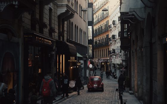 Explore a bustling alley in İstanbul with vintage charm and city life atmosphere.