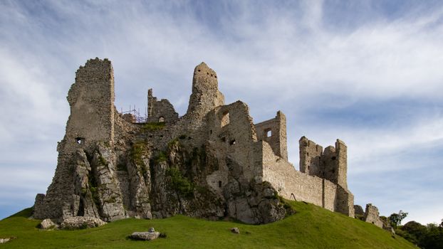 Scenic view of Hrušov Castle ruins in Slovakia, symbolizing medieval history.